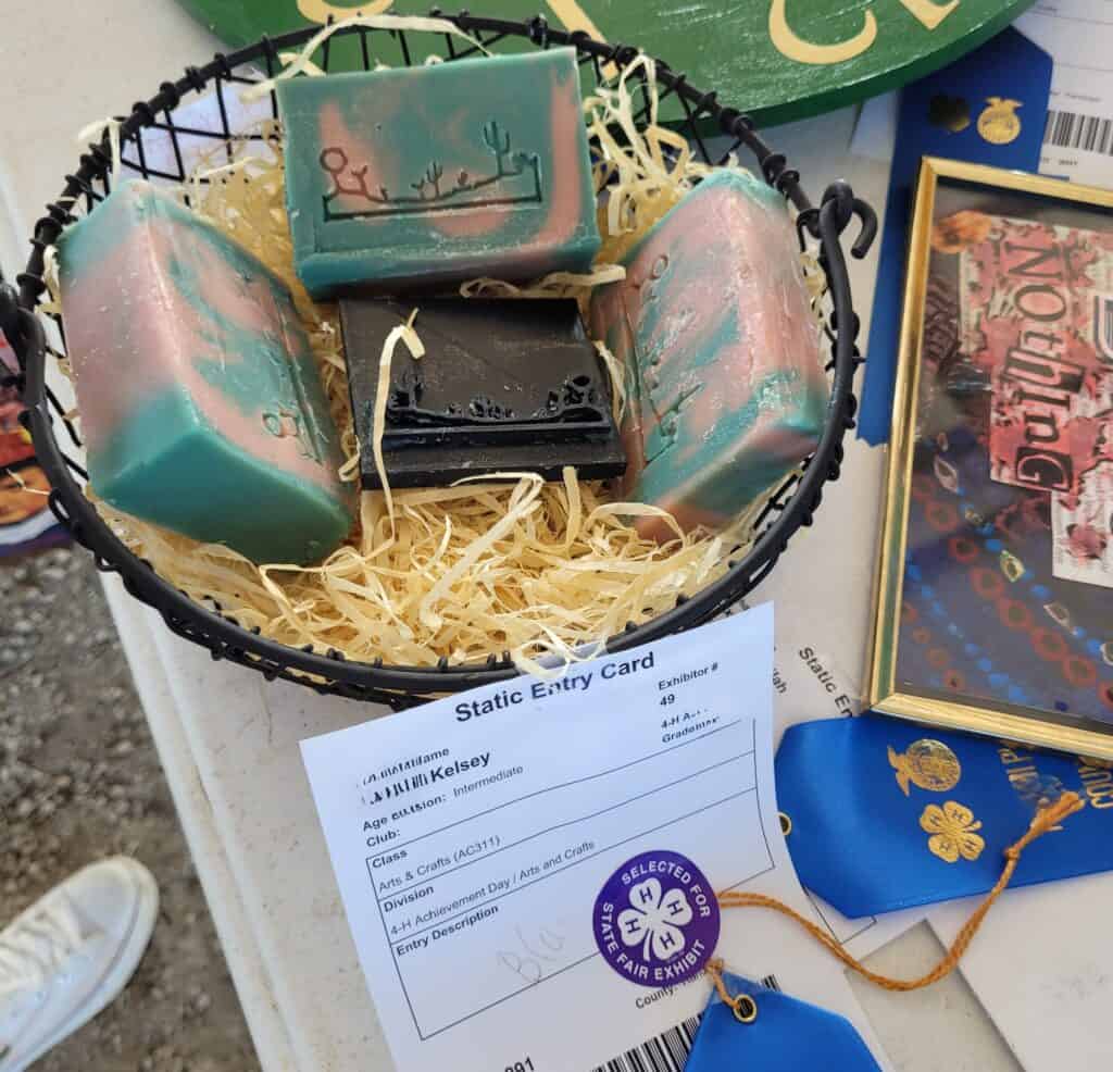 goat milk soap on display at county fair with a sticker showing selected for exhibit at state fair