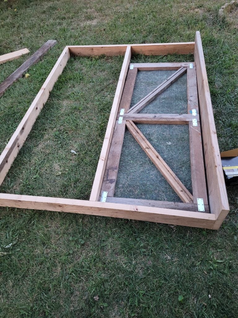 improving the coop with a rectangular frame for front of chicken run with a screen door 