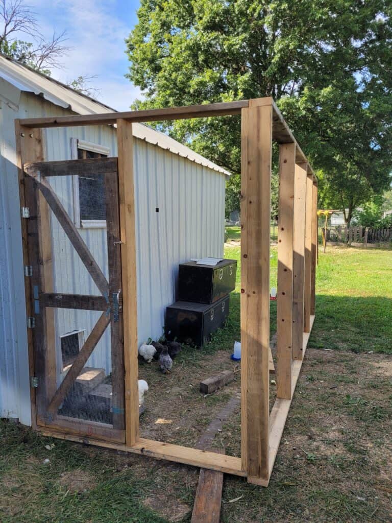 wooden frame for a chicken run attached to chicken coop